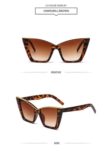 Detail view of retro cat-eye sunglasses with tortoiseshell frame and gold metal accents