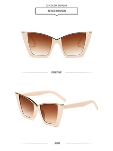 Detailed view of beige cat-eye sunglasses with brown gradient lenses and gold top trim