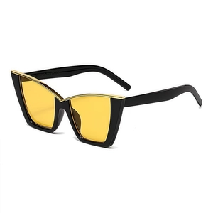 Fashionable oversized cat eye sunglasses with yellow lenses and gold metal trim