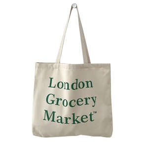 Minimalist canvas tote bag featuring green London Grocery Market print on cream fabric