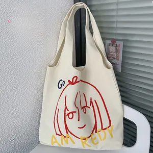 Close-up of artistic cartoon print on large capacity canvas tote bag for women