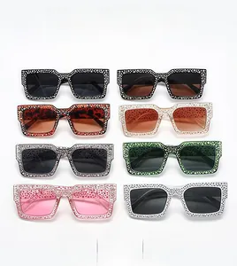 Close-up of square rhinestone sunglasses in various colors on a clean white background