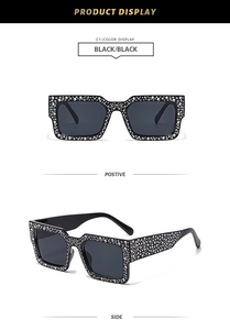 Detail of square oversized sunglasses with sparkling rhinestones on black frames