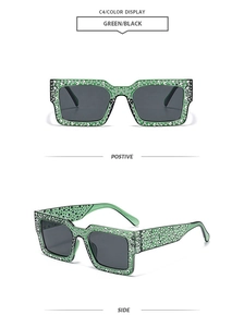 Detail of green square oversized sunglasses with sparkling rhinestones on the frame edges