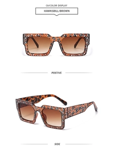 Detail of square tortoiseshell sunglasses with white rhinestones and brown gradient lenses