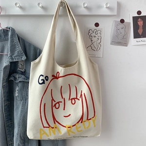 Artistic cream canvas tote bag with red line girl illustration and hanging side detail