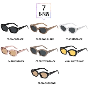 Flat lay of retro oval sunglasses showcasing seven assorted frame colors and lenses