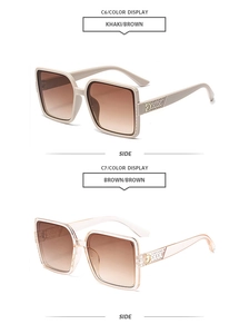Détail de lunettes de soleil carrées kaki et marron avec un logo D métallique sur le côté