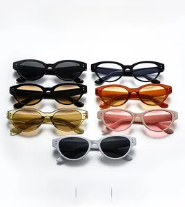 Cat eye sunglasses detail showing multiple colors like amber, blue and white frames