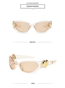 Detail view of champagne Y2K cat eye sunglasses featuring gold heart accents on temples