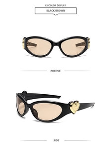 Detail of black oval sunglasses with golden heart hinges and brown tinted lenses