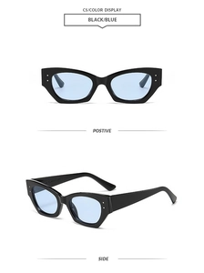 Détails des lunettes de soleil œil de chat, monture noire, verres bleus et rivets en métal