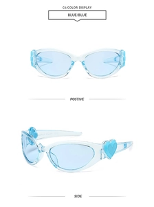 Detail of light blue Y2K oval sunglasses with 3D heart decoration on the side temples