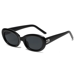 Vintage oval black sunglasses with silver metal accents and dark protective lenses