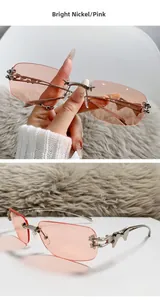 Close-up of frameless pink lenses with star-shaped metal accents and silver temples