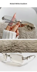 Close-up of rimless star sunglasses featuring metal star details and gradient lenses