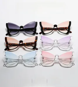 Flat lay of butterfly frame sunglasses in various gradient colors on white background