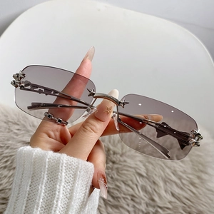 Star-studded rimless sunglasses with gradient grey lenses and Y2K star metal accents