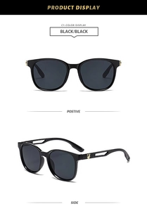 Detail of black sunglasses featuring a golden panther metal emblem on hollowed temples