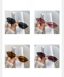 Cat eye rimless sunglasses with chain edges shown in four colors with leather cases