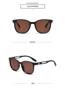 Detail of vintage black sunglasses featuring golden leopard decor on hollowed temples