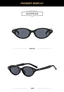 Detail of vintage round sunglasses with black frames and silver stud accents