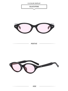 Front and side views of vintage oval black sunglasses with pink lenses and silver rivets
