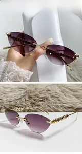 Detail of purple gradient cat-eye sunglasses featuring textured gold metal temples