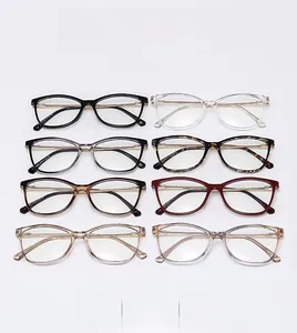 Detail view of eight vintage cat-eye glasses frames in assorted colors on white background