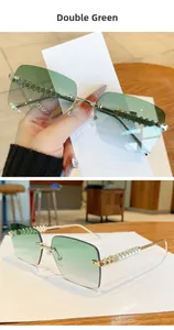 Detail view of gold metal temples with textures and green gradient rimless lenses