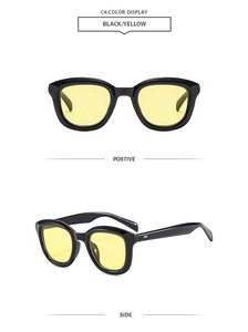 Detail view of retro square black frames with yellow tinted lenses and side numbers