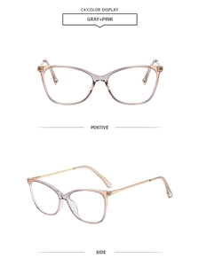 Detail view of cat eye glasses in gray and pink gradient with slim gold metal temples