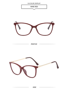 Detail view of wine red cat eye glasses frame with elegant golden metal temples
