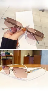 Detail of rimless sunglasses with brown pink gradient lens and golden textured temple