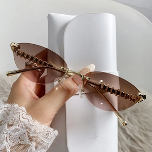 Fashion rimless cat-eye sunglasses with gold metal studs and white leather storage case