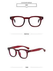 Detail of red square sunglasses with retro frame and silver arrow rivet accents