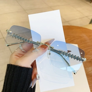 Frameless square sunglasses with blue gradient lenses and silver textured metal temples