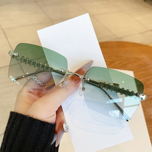 Fashionable rimless square sunglasses with gradient lenses and ornate metal temples