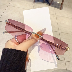 Retro rimless rectangular sunglasses with pink gradient lenses and wavy metal temples