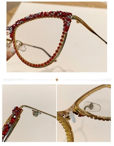 Close-up of cat-eye frames featuring pavé-set red and silver rhinestones and metal nose pads