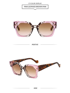 Detail view of pink leopard sunglasses with gradient brown lenses and golden metal trim