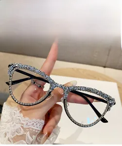 Detail shot of cat eye glasses frames with rhinestone embellishments on black rims