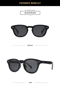 Vues de face et de côté de lunettes de soleil noires avec rivets en argent