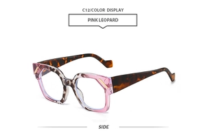 Detail view of pink leopard polygon sunglasses frame with stylish golden metal trim