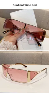 Macro view of gradient wine red shield sunglasses with gold metal frame and tortoise tips