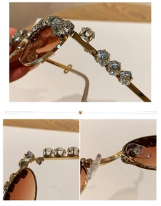 Close-up of gold metal sunglasses frame with luxury rhinestones and brown gradient lenses