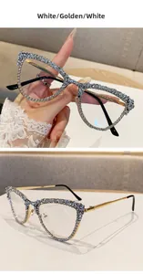 Detail of cat-eye frames with white and clear rhinestones and golden metal temples