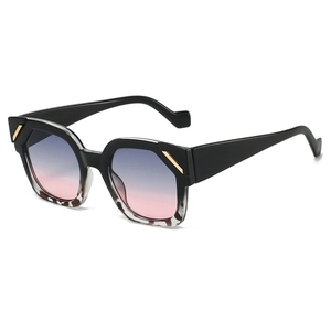 Chic polygonal sunglasses with black and tortoiseshell frames and blue-pink gradient lenses