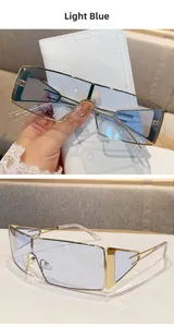 Detail of light blue lenses and gold metal frame of these oversized punk sunglasses
