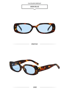 Detail view of demi tortoise frame sunglasses with light blue translucent lenses